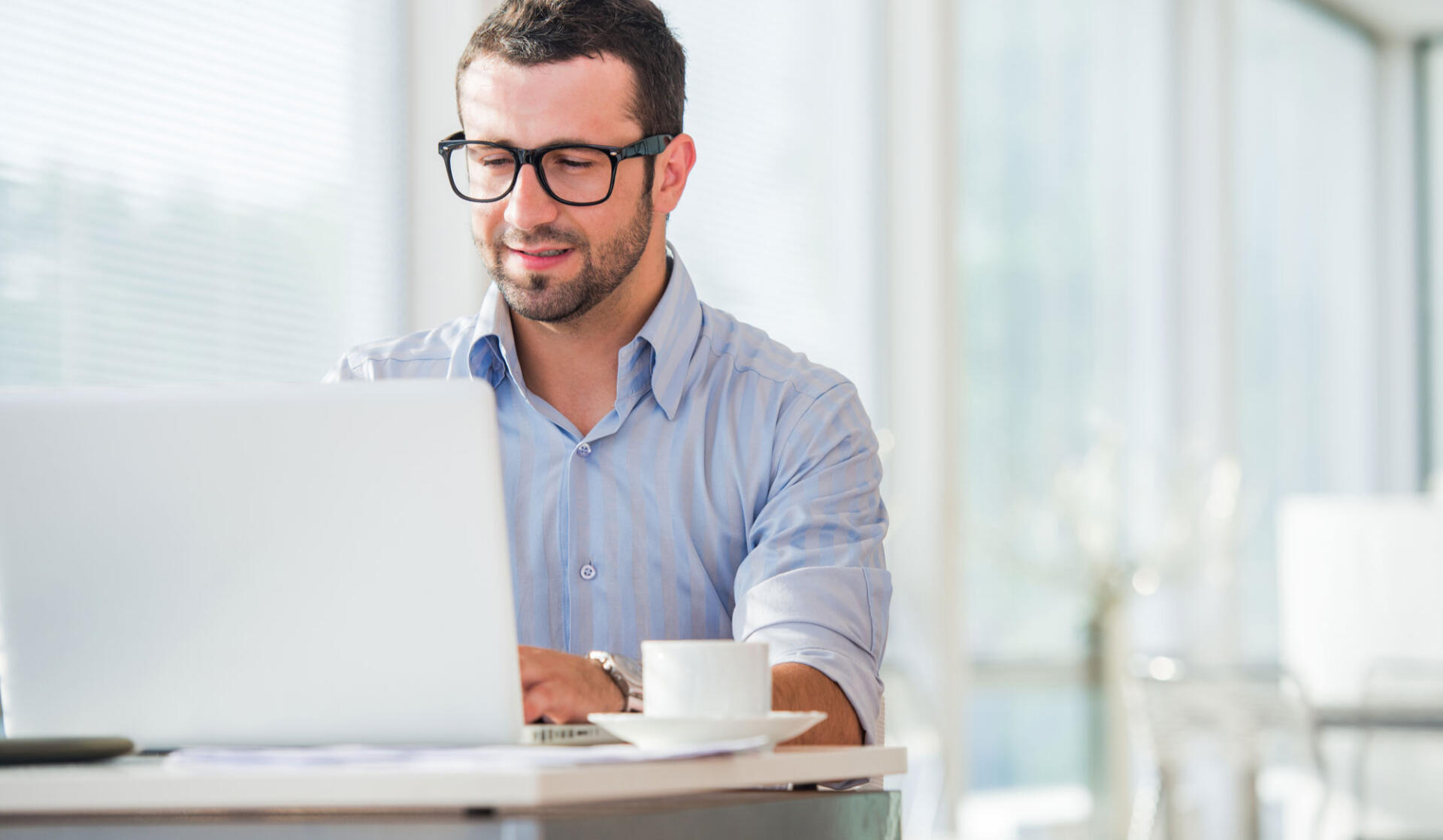 male accountant at keyboard